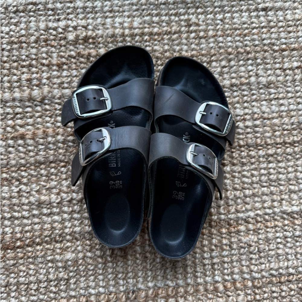 Birkenstock black and silver big buckle sandals.